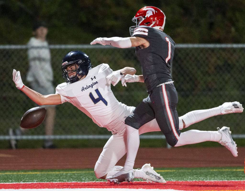 Stanwoods Cole Williams has pass interference called causing Arlingtons Jake Willis to miss a pass during the Stilly Cup game on Friday, Oct. 11, 2024 in Stanwood, Washington. (Olivia Vanni / The Herald)