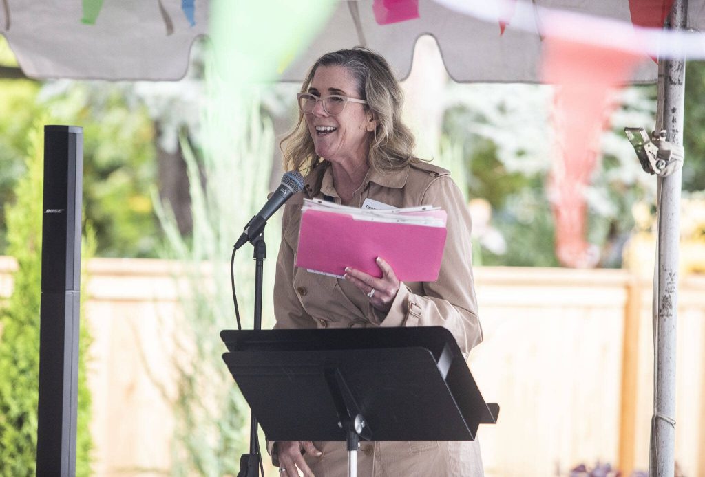 Housing Hope CEO Donna Moulton speaks to those gathered for the Madrona Highlands welcoming ceremony on Tuesday, Oct. 15, 2024 in Edmonds, Washington. (Olivia Vanni / The Herald)