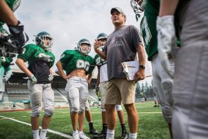 Edmonds-Woodway coach John Gradwohl talks to his players during Edmonds-Woodway High School football practice on Aug. 24, 2018 in Edmonds, Wash. (Olivia Vanni / The Herald)