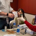 FILE — Luzerne County Bureau of Elections officials and city employees sort through and count mail-in and absentee ballots, in the Luzerne County Government Center in Wilkes Barre, Pa., Nov. 4, 2020. Voting by mail is increasingly popular, but mail ballots are rejected far more often than in-person ones. In Pennsylvania and elsewhere, parties are battling over which ones to count — or not. (Robert Nickelsberg/The New York Times)