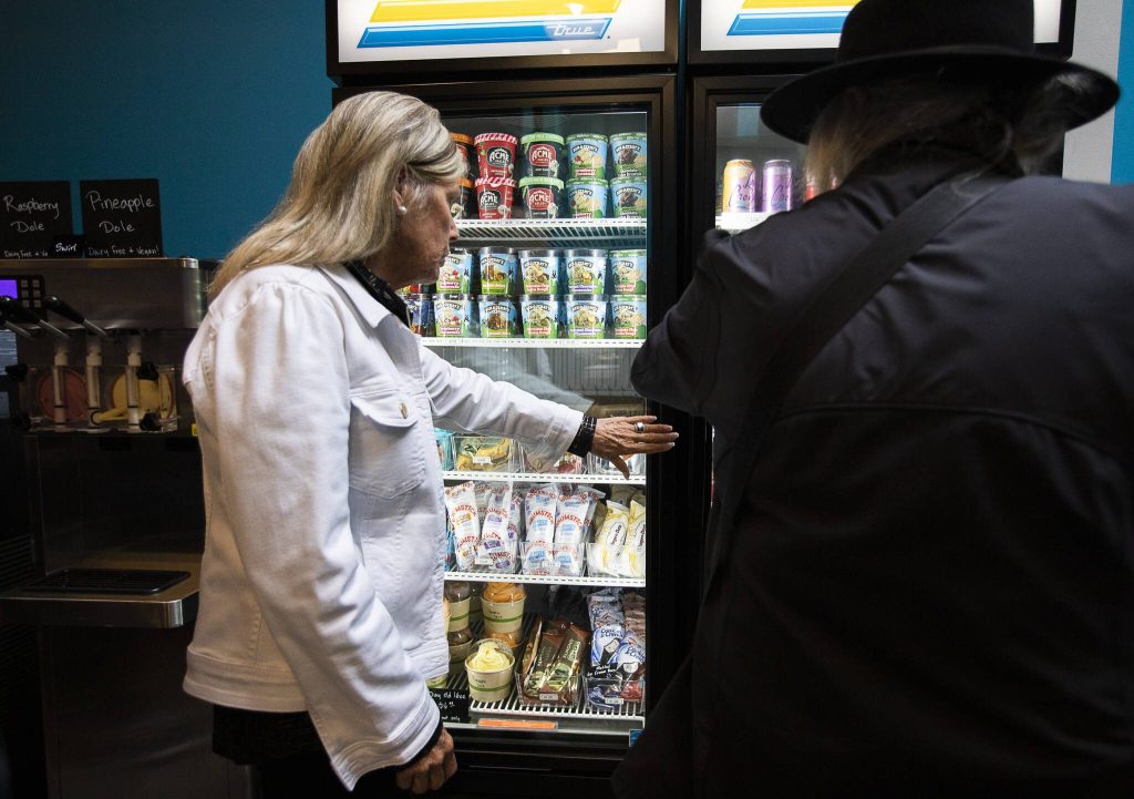 People look through the ice cream selection at The Ice Cream Bar on Friday, Oct. 18, 2024 in Everett, Washington. (Olivia Vanni / The Herald)