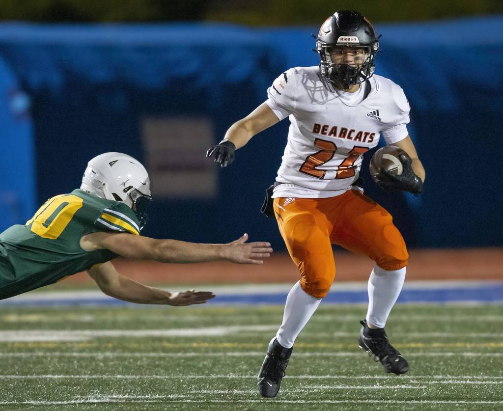 Monroes BK Kingsley escapes a tackle during the game against Shorecrest on Friday, Oct. 18, 2024 in Shoreline, Washington. (Olivia Vanni / The Herald)