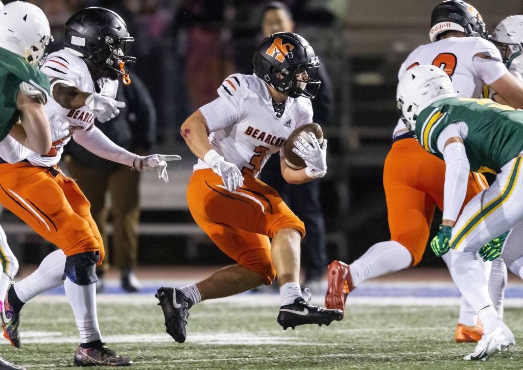 Monroes Aaron Clifton runs through an opening during the game against Shorecrest on Friday, Oct. 18, 2024 in Shoreline, Washington. (Olivia Vanni / The Herald)