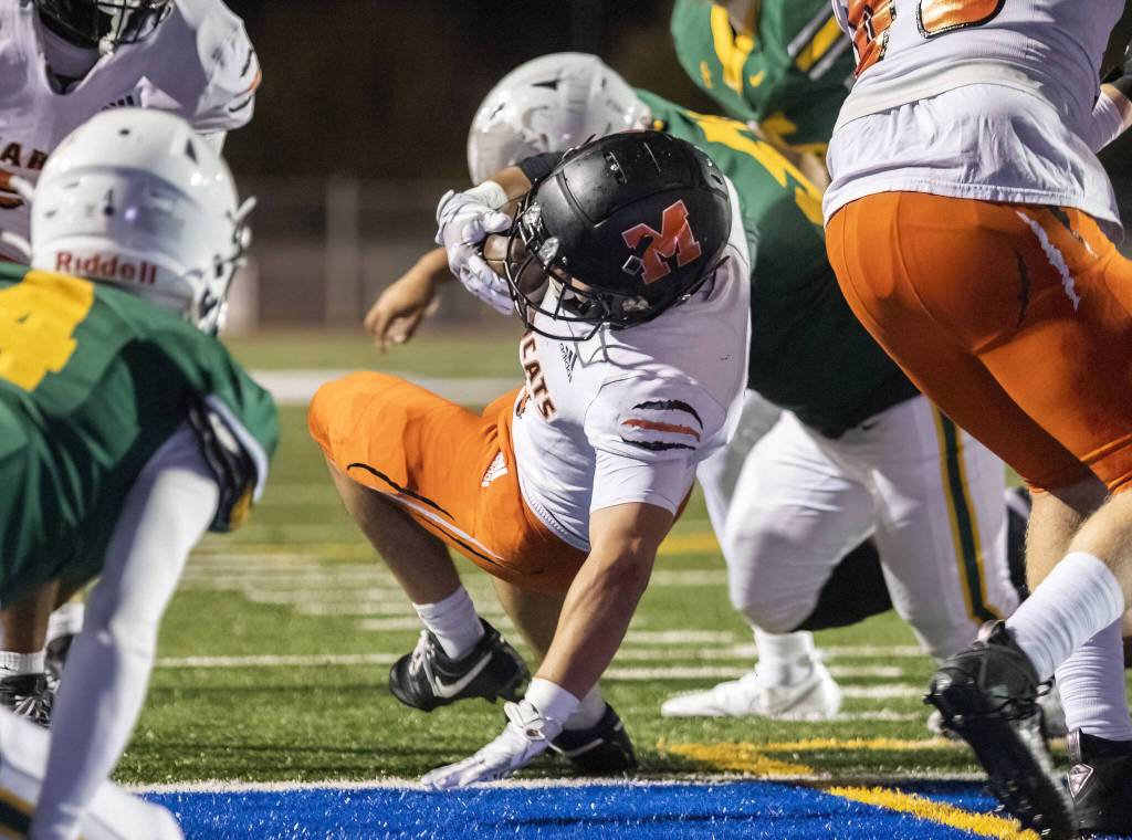 Monroes Aaron Clifton falls into the end zone for a touchdown during the game against Shorecrest on Friday, Oct. 18, 2024 in Shoreline, Washington. (Olivia Vanni / The Herald)