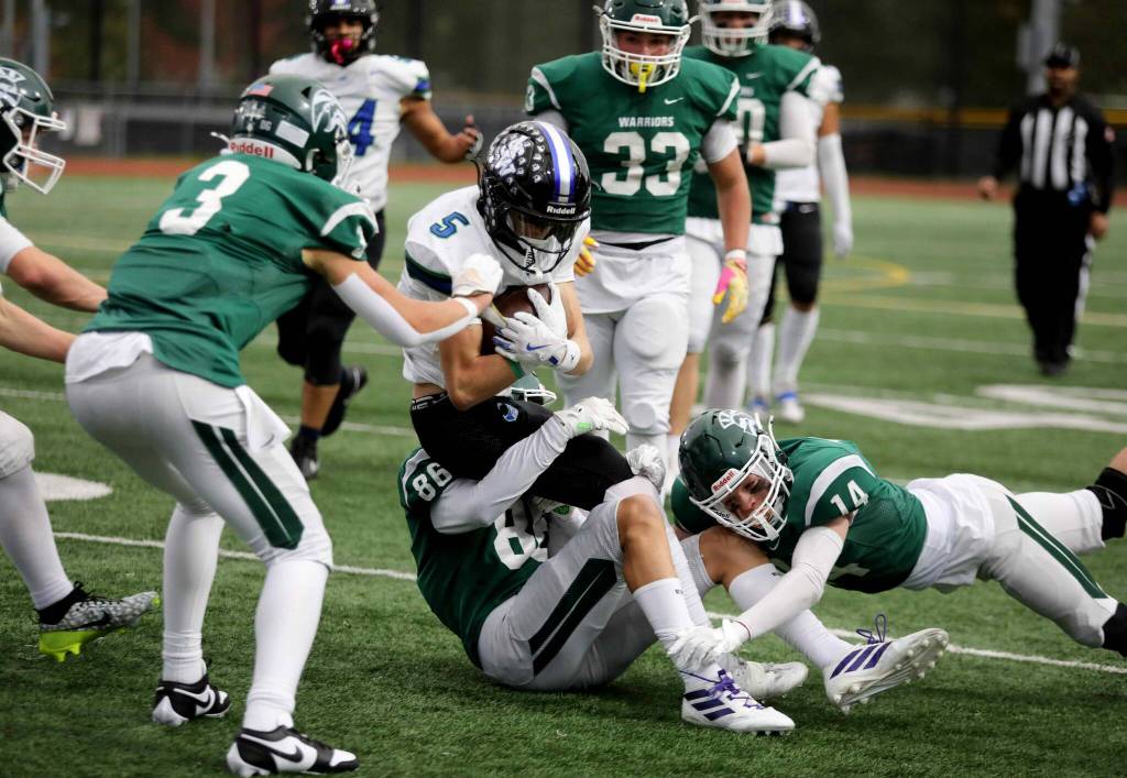 Shorewood junior wide receiver Finn Bachler gets tackled during a Wesco 3A South matchup against Edmonds-Woodway in Edmonds, Wash., on Oct. 18, 2024. Shorewood won 31-13. (Taras McCurdie / The Herald)