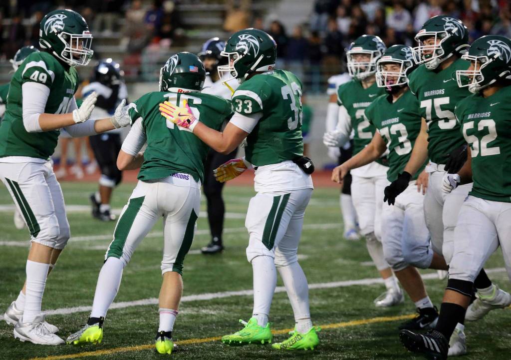 Edmonds-Woodway sophomore running back Nathan Schlack gets patted on the back after scoring a touchdown during a Wesco 3A South matchup against Shorewood in Edmonds, Wash., on Oct. 18, 2024. Shorewood won 31-13. (Taras McCurdie / The Herald)