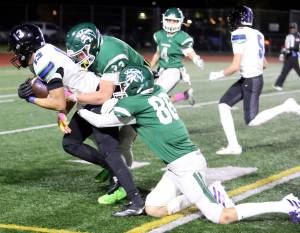 Shorewood senior wide receiver Niko Zacharias gets tackled during a Wesco 3A South matchup against Edmonds-Woodway in Edmonds, Wash., on Oct. 18, 2024. Shorewood won 31-13. (Taras McCurdie / The Herald)