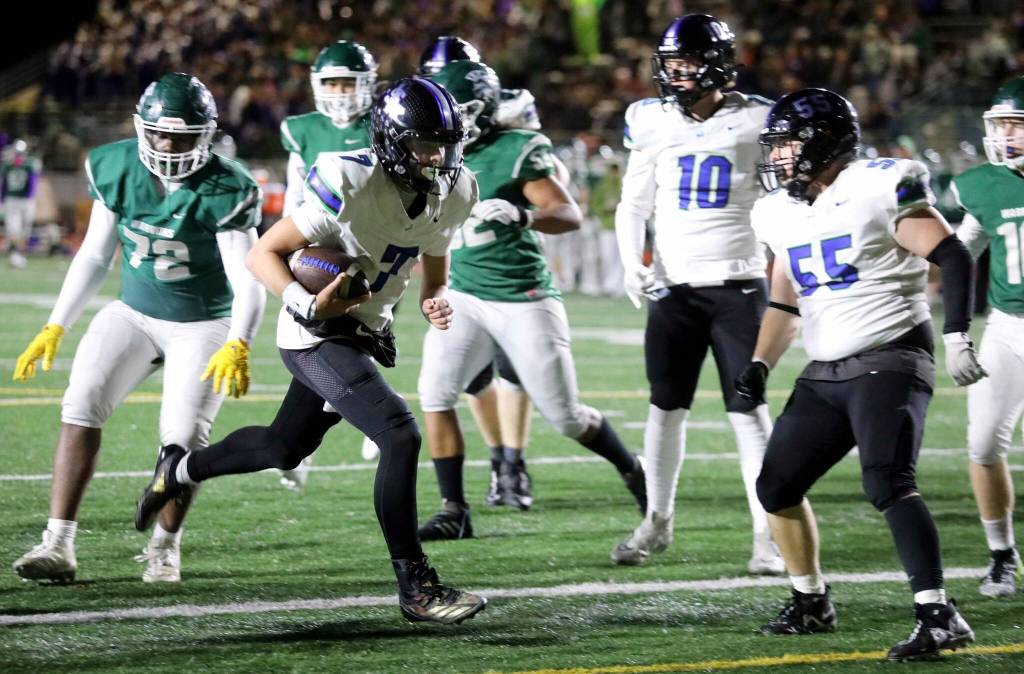 Shorewood senior quarterback Tyler Giles scores a touchdown during a Wesco 3A South matchup against Edmonds-Woodway in Edmonds, Wash., on Oct. 18, 2024. Shorewood won 31-13. (Taras McCurdie / The Herald)