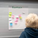 Attendees give feedback via Post-it notes and feedback forms at Wednesdays meeting at Marysville Pilchuck High School. (Will Geschke / The Herald)