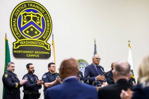 Gov. Jay Inslee thanks Sen. John Lovick and others gathered for the soft opening of the new Criminal Justice Training Commission Northwest Regional Campus on Tuesday, Oct. 22, 2024 in Arlington, Washington. (Olivia Vanni / The Herald)