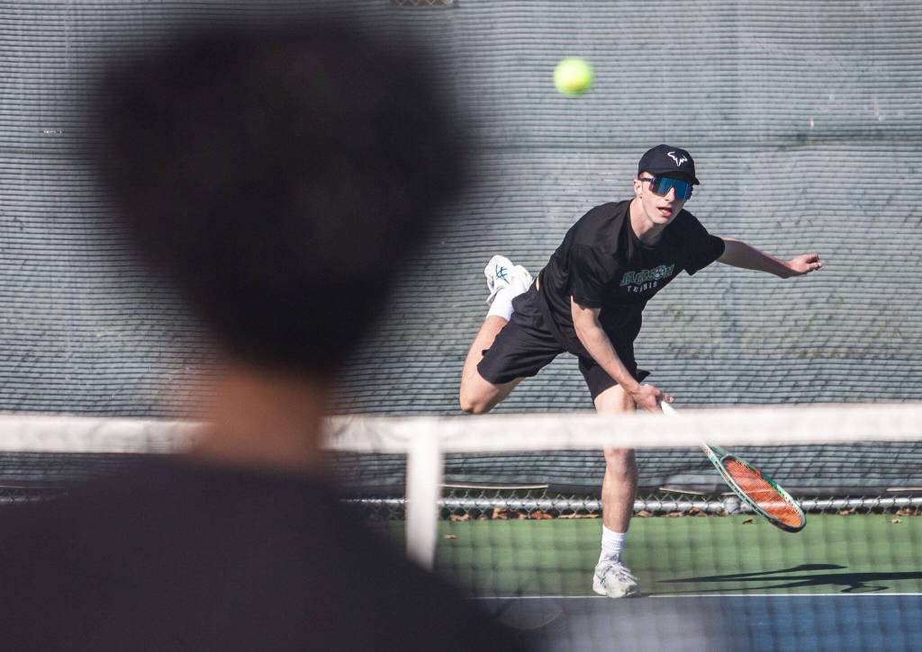 Andy Stark serves the ball during the district championship doubles match on Thursday, Oct. 24, 2024 in Snohomish, Washington. (Olivia Vanni / The Herald)