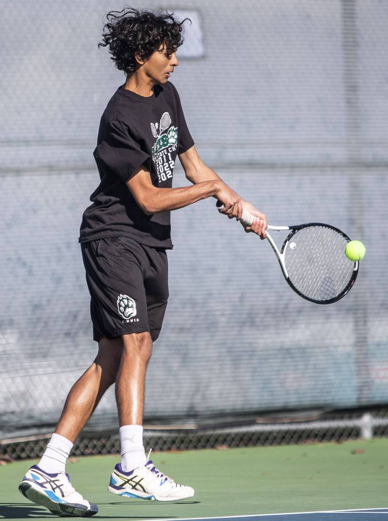 Arhan Sinha runs after the ball during the district championship doubles match on Thursday, Oct. 24, 2024 in Snohomish, Washington. (Olivia Vanni / The Herald)