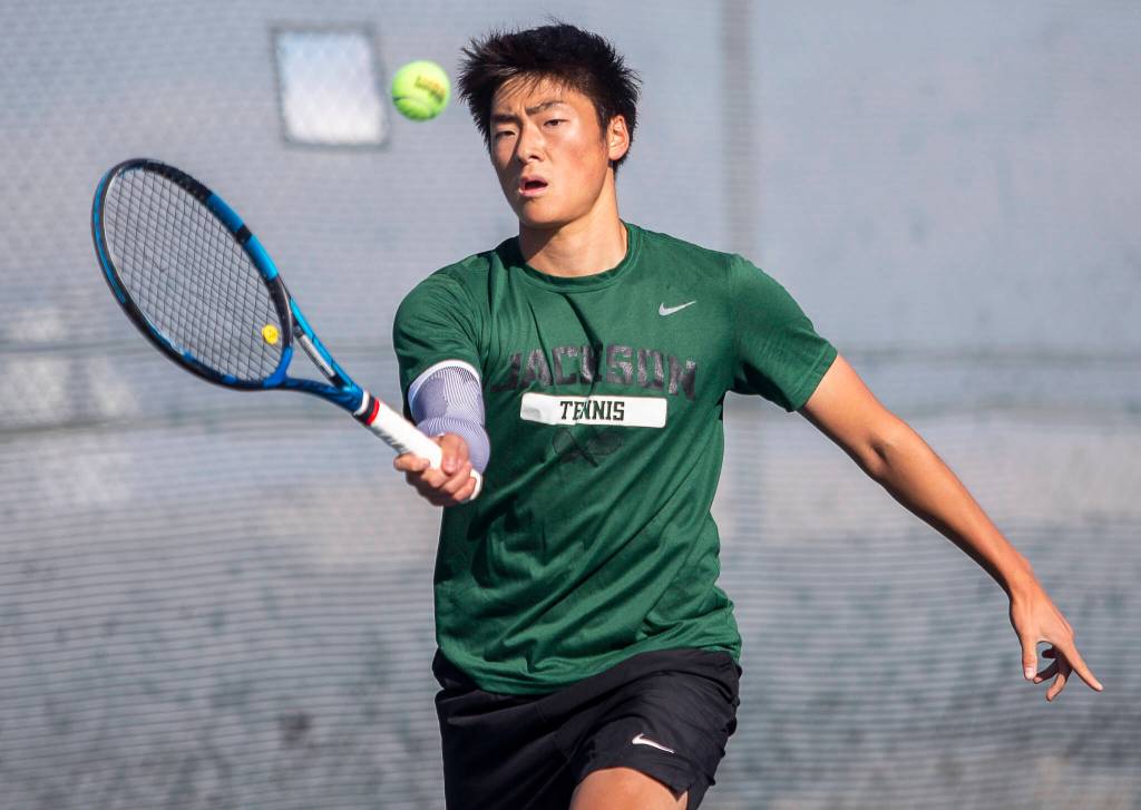 Ben Lee reaches out to hit the ball during the district championship singles match on Thursday, Oct. 24, 2024 in Snohomish, Washington. (Olivia Vanni / The Herald)