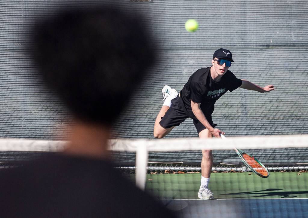 Andy Stark serves the ball during the district championship doubles match on Thursday, Oct. 24, 2024 in Snohomish, Washington. (Olivia Vanni / The Herald)
