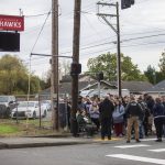 Parents of Marysville Pilchuck students, family, friends and community members gather outside of the high school to receive information from Marysville police Cmdr. Robb Lamoureux after the school was placed on lockdown on Friday, Oct. 25, 2024 in Marysville, Washington. (Olivia Vanni / The Herald)