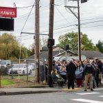 Parents of Marysville Pilchuck students, family, friends and community members gather outside of the high school to receive information from Marysville Police Commander Robb Lamoureux after the school was placed on locked down on Friday, Oct. 25, 2024 in Marysville, Washington. (Olivia Vanni / The Herald)