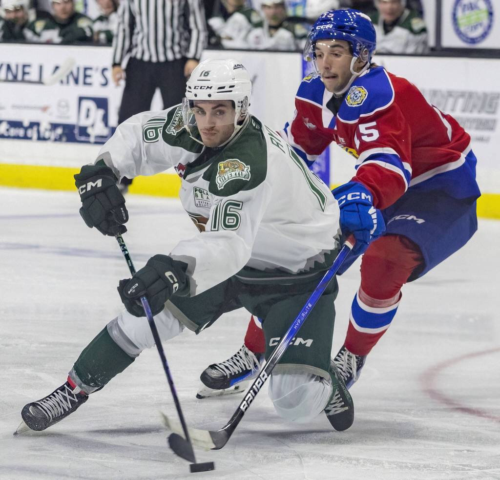 Silvertips Dominik Rymon maneuvers around an Edmonton player to try and get an open shot during the game against the Edmonton Oil Kings on Friday, Oct. 25, 2024 in Everett, Washington. (Olivia Vanni / The Herald)