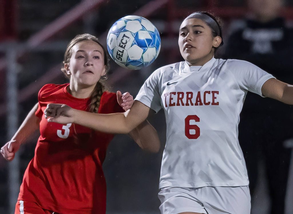 Mountlake Terraces Eva Gomez and Stanwoods Leise Harriss both try and trap the ball during the 3A district game on Thursday, Oct. 31, 2024 in Stanwood, Washington. (Olivia Vanni / The Herald)