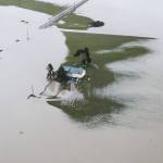 A house is completely surrounded by floodwater along Pioneer Highway on Wednesday, Dec. 6, 2023 in Stanwood, Washington. (Olivia Vanni / The Herald)