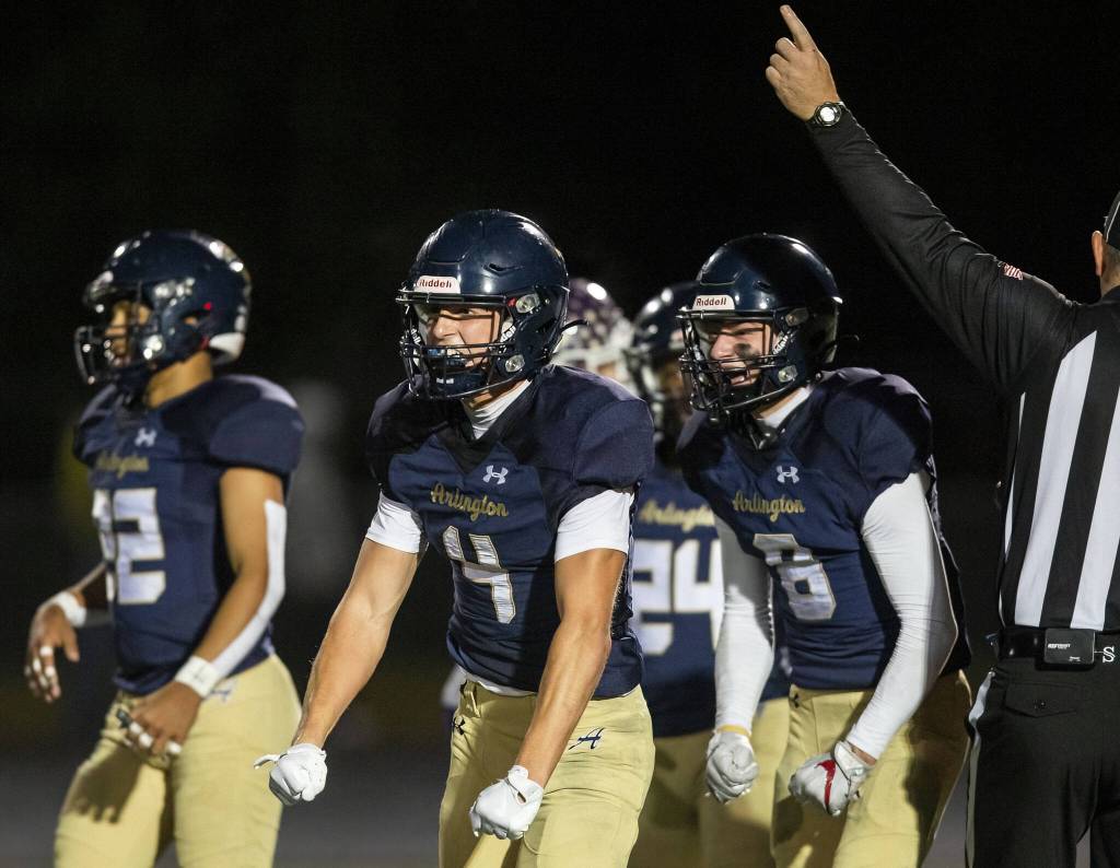 Arlingtons Jake Willis celebrates getting a pick during the game against Lake Stevens on Friday, Nov. 1, 2024 in Arlington, Washington. (Olivia Vanni / The Herald)