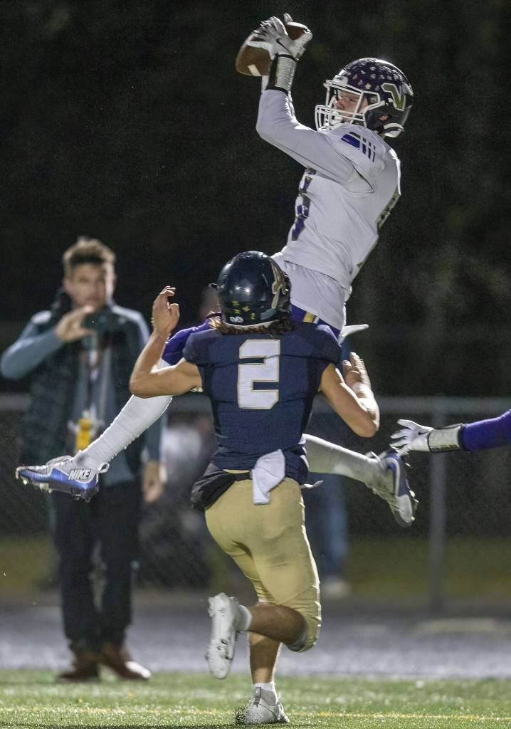 Lake Stevens Dylan Phinney picks off a pass in the end zone during the game against Arlington on Friday, Nov. 1, 2024 in Arlington, Washington. (Olivia Vanni / The Herald)