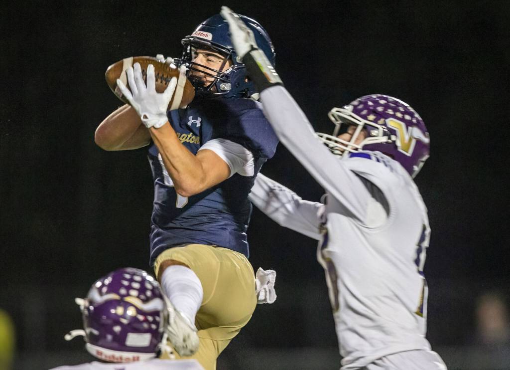 Arlingtons Jake Willis picks off a pass during the game against Lake Stevens on Friday, Nov. 1, 2024 in Arlington, Washington. (Olivia Vanni / The Herald)