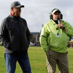 Stanwood coach Mike Evans is announced before the 2024 District 1/2 Cross Country 3A girls race at Lakewood High School in Arlington, Wash., on Nov. 2, 2024. Evans is retiring after this season and was the founder of the Hole in the Wall meet. (Taras McCurdie / The Herald)