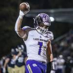 Lake Stevens Keagan Howard raises the ball in the air in celebration after running into the end zone for a touchdown during the game against Arlington on Friday, Nov. 1, 2024 in Arlington, Washington. (Olivia Vanni / The Herald)