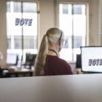 Snohomish County Elections employees check signatures on ballots on Oct. 29 in Everett. (Olivia Vanni / The Herald)