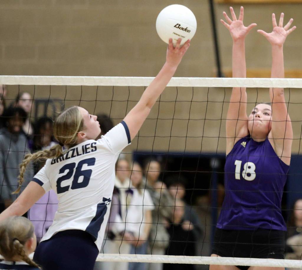 Glacier Peak senior outside hitter Ava Nowak tips the ball over the net during the Wesco 4A title game in Snohomish, Wash., on Monday, Nov. 4, 2024. The Vikings won in four sets, 3-1. (Taras McCurdie / The Herald)