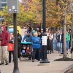 Voters in line for a polling place at the Community College of Philadelphia on Tuesday. Democrats say initial signs indicated turnout in the city is strong. (Jessica Griffin / The Philadelphia Inquirer)