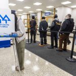 Nora Xue, 24, fills out her ballot at the Snohomish County Auditors Office on Tuesday in Everett. (Olivia Vanni / The Herald)