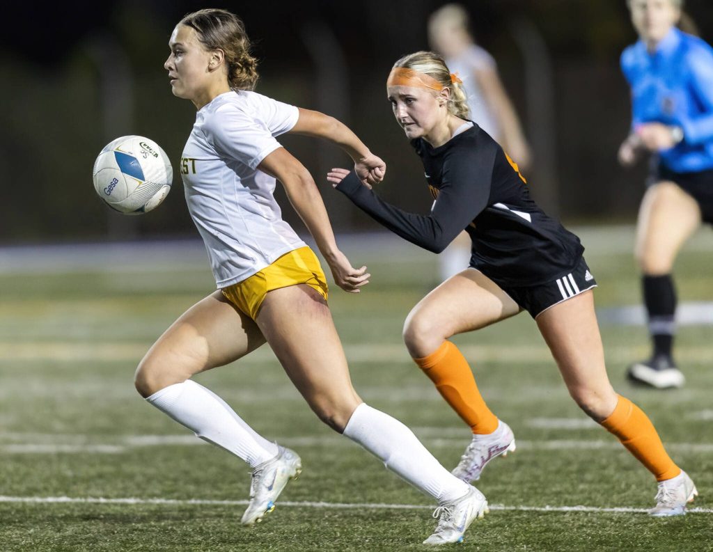 Shorecrests Olivia Taylor runs through the ball with her chest while running down the field during the 3A district game against Monroe on Thursday, Nov. 7, 2024 in Shoreline, Washington. (Olivia Vanni / The Herald)