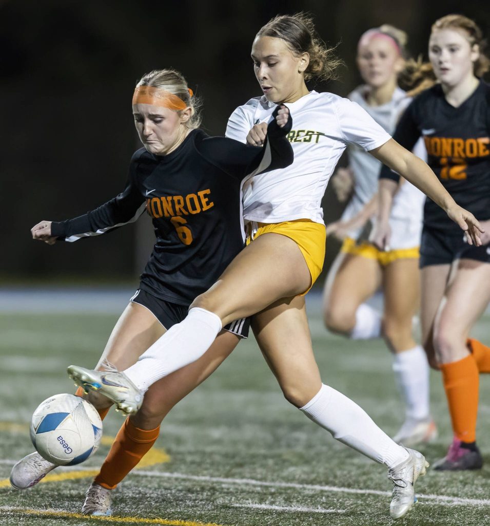 Shorecrests Olivia Taylor reaches her leg around Monroes Ashtyn Wheeler to get control of the ball during the 3A district game on Thursday, Nov. 7, 2024 in Shoreline, Washington. (Olivia Vanni / The Herald)