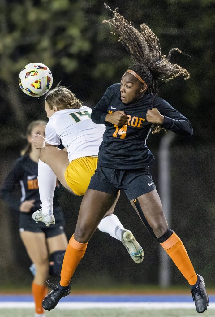 Shorecrests Olivia Taylor and Monroes Halle Keller both leap in the air to head the ball during the 3A district game on Thursday, Nov. 7, 2024 in Shoreline, Washington. (Olivia Vanni / The Herald)