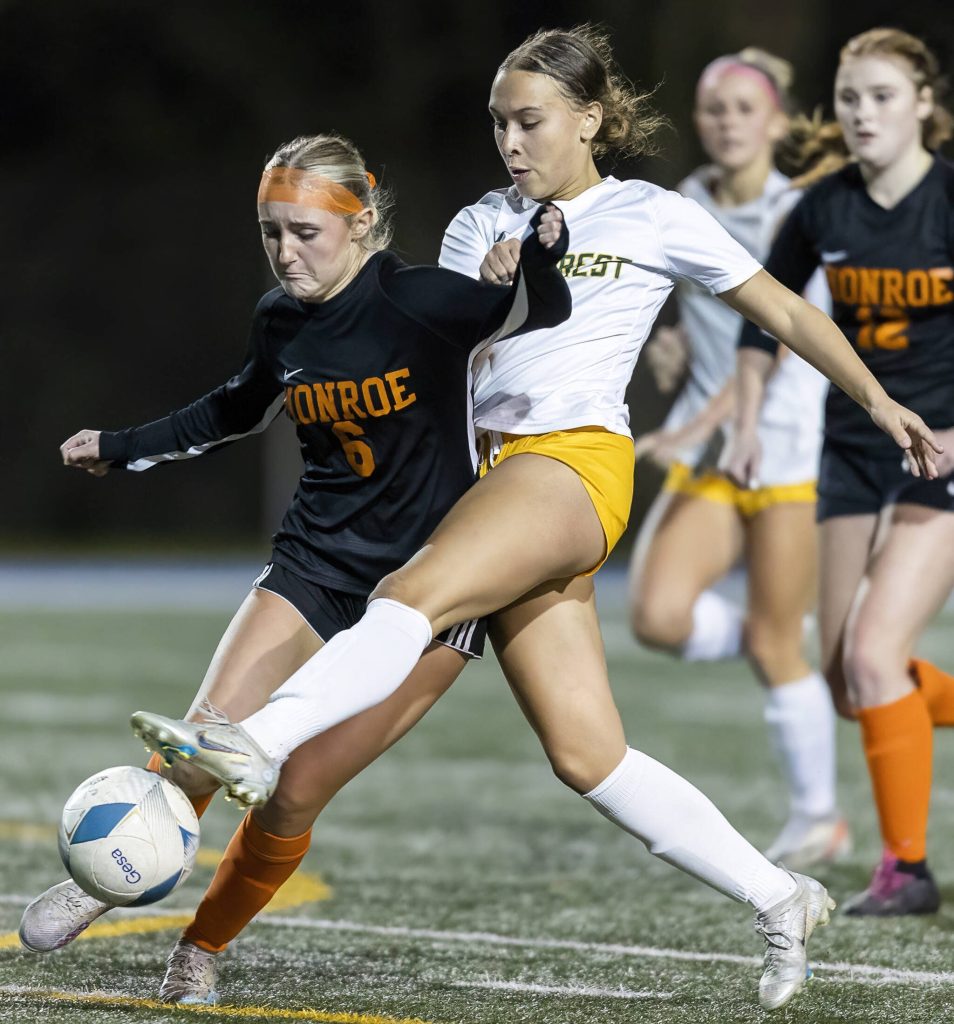 Shorecrests Olivia Taylor reaches her leg around Monroes Ashtyn Wheeler to get control of the ball during the 3A district game on Thursday, Nov. 7, 2024 in Shoreline, Washington. (Olivia Vanni / The Herald)