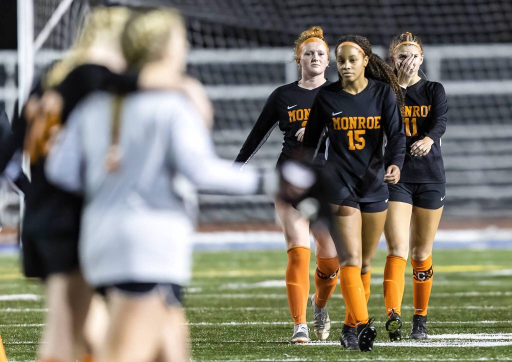 Monroes Sydney Garner, right, wipes away tears after losing to Shorecrest in the 3A district game on Thursday, Nov. 7, 2024 in Shoreline, Washington. (Olivia Vanni / The Herald)
