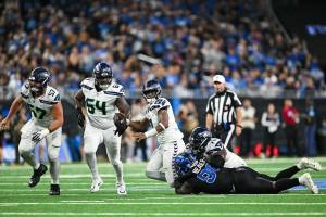 Seahawks offensive linemen Connor Williams (57), Christian Haynes (64) and Laken Tomlinson (70) attempt to block for Geno Smith (7) against the Detroit Lions at Ford Field on Monday, Sept. 30, 2024 (Photo courtesy of the Seattle Seahawks)