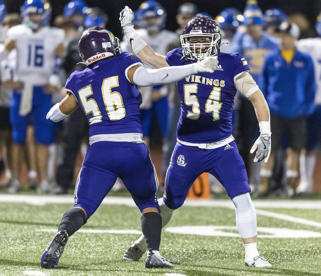 Lake Stevens Kayden Blanchard and teammate Brayden Dougherty celebrate a sack during the 4A district game against Tahoma on Friday, Nov. 8, 2024 in Lake Stevens, Washington. (Olivia Vanni / The Herald)
