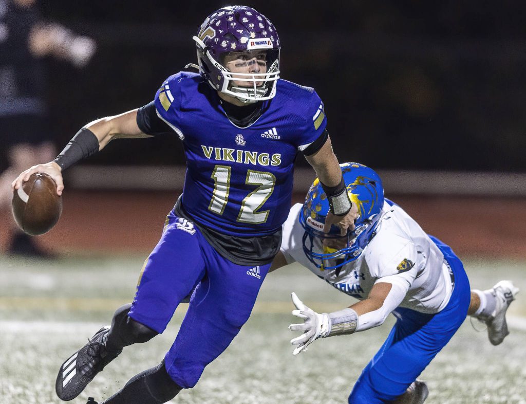 Lake Stevens Kolton Matson escapes a tackle during the 4A district game against Tahoma on Friday, Nov. 8, 2024 in Lake Stevens, Washington. (Olivia Vanni / The Herald)