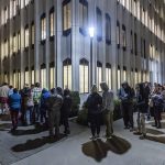 The line for the Snohomish County Auditors Office extends around the Admin West building and onto Pacific Avenue Election Day as people wait for same-day registration, ballot issuance and accessible voting services on Nov. 5 in Everett, Washington. (Olivia Vanni / The Herald)