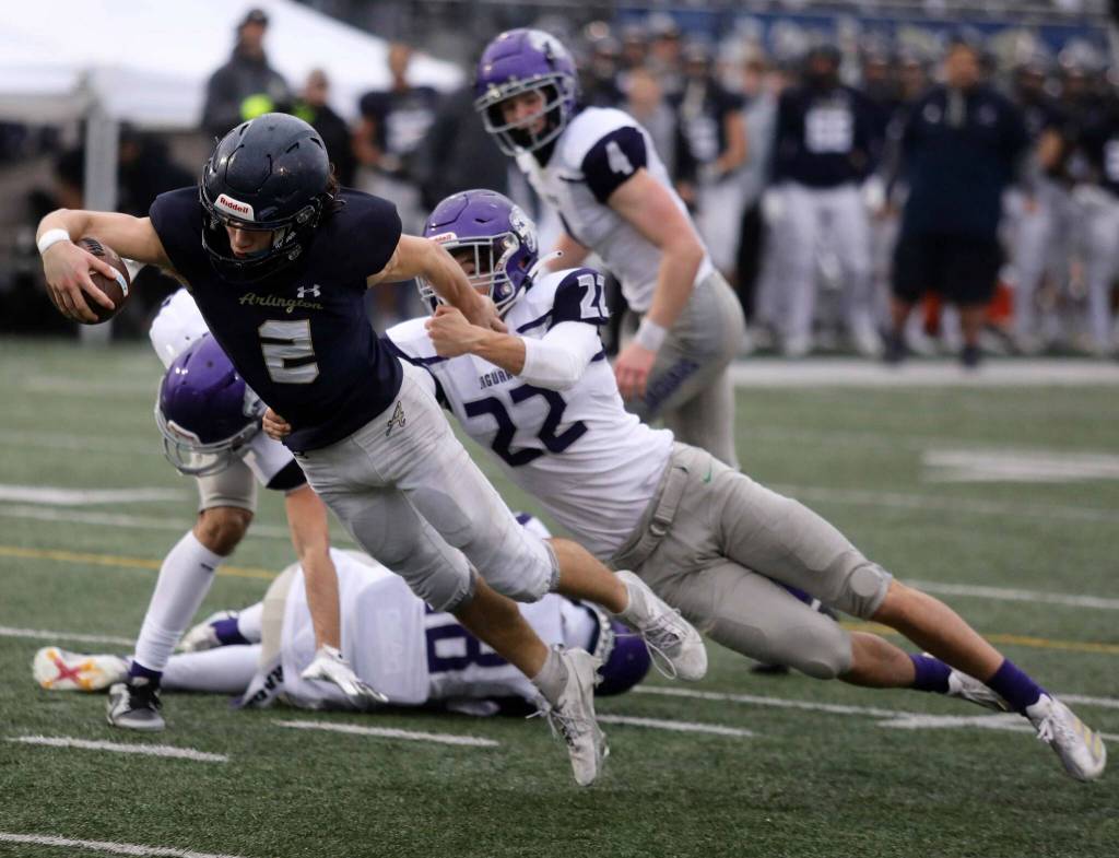 Arlington senior wide receiver Chase Deberry lunges into the end zone during a district winner-to-state, loser-out Round of 32 game at John C. Larson Stadium in Arlington, Wash., on Saturday, Nov. 9, 2024. The Eagles won 56-35. (Taras McCurdie / The Herald)