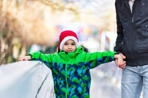 Single father and son enjoying ice-skating together. Photo courtesy of Kaiser Permanente.