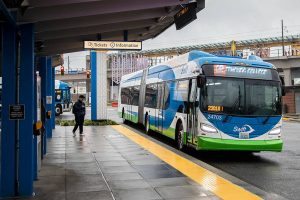 A person walks toward their bus as it pull into the Lynnwood Transit Center on Thursday, Nov. 14, 2024 in Lynnwood, Washington. (Olivia Vanni / The Herald)