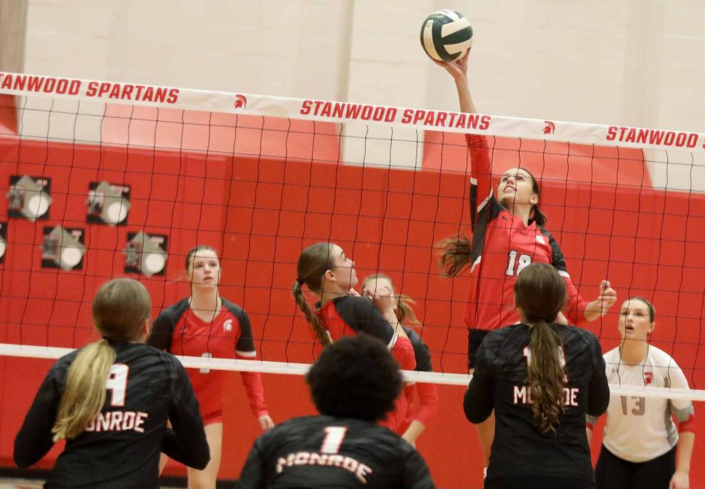 Stanwood sophomore outside hitter Whitney Longspaugh tips the ball during a District 1 3A quarterfinals match against Monroe in Stanwood, Wash., on Tuesday, Nov. 12, 2024. The Spartans won 3-1. (Taras McCurdie / The Herald)