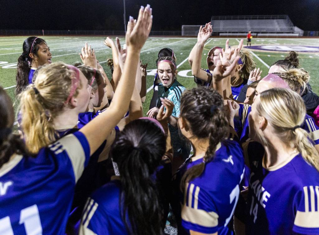 Lake Stevens players cheer before the start of the 4A state playoff game against Richland on Wednesday, Nov. 13, 2024 in Lake Stevens, Washington. (Olivia Vanni / The Herald)