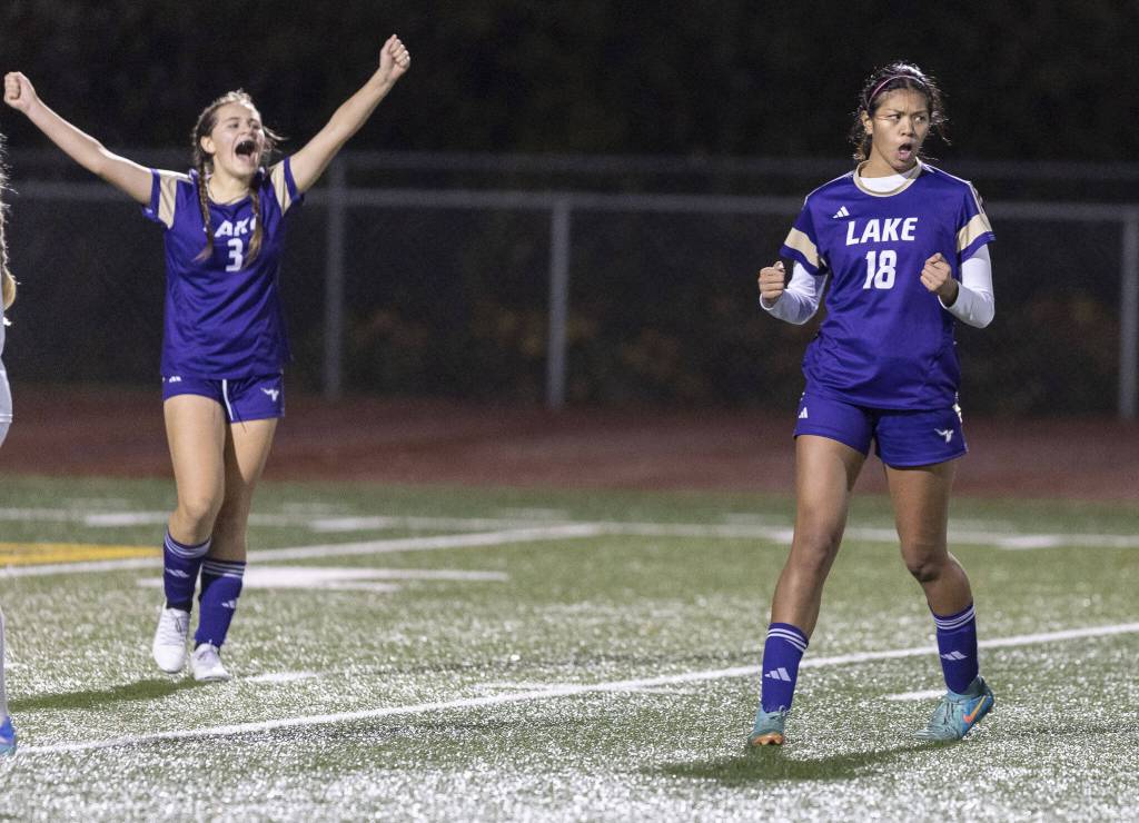 Lake Stevens Noelani Tupua yells in celebration after scoring during the 4A state playoff game against Richland on Wednesday, Nov. 13, 2024 in Lake Stevens, Washington. (Olivia Vanni / The Herald)