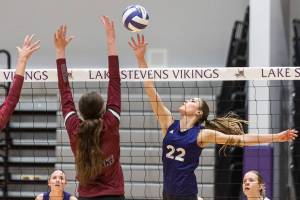 Lake Stevens’ Laura Eichert tips the ball over the net during the 4A district semifinal game on Thursday, Nov. 14, 2024 in Lynnwood, Washington. (Olivia Vanni / The Herald)