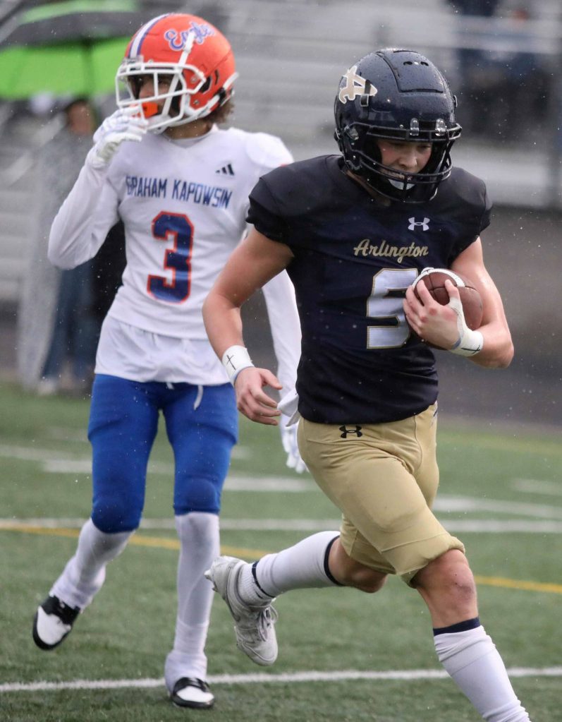 Arlington junior wide receiver Eli Rae runs into the end zone during a first-round game of the Class 4A state tournament against Graham-Kapowsin in Arlington, Wash., on Saturday, Nov. 16, 2024. The Eagles won, 42-6. (Taras McCurdie / The Herald)