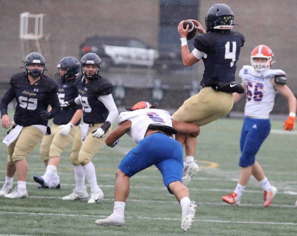 Arlington senior wide receiver Jake Willis catches a pass during a first-round game of the Class 4A state tournament against Graham-Kapowsin in Arlington, Wash., on Saturday, Nov. 16, 2024. The Eagles won, 42-6. (Taras McCurdie / The Herald)